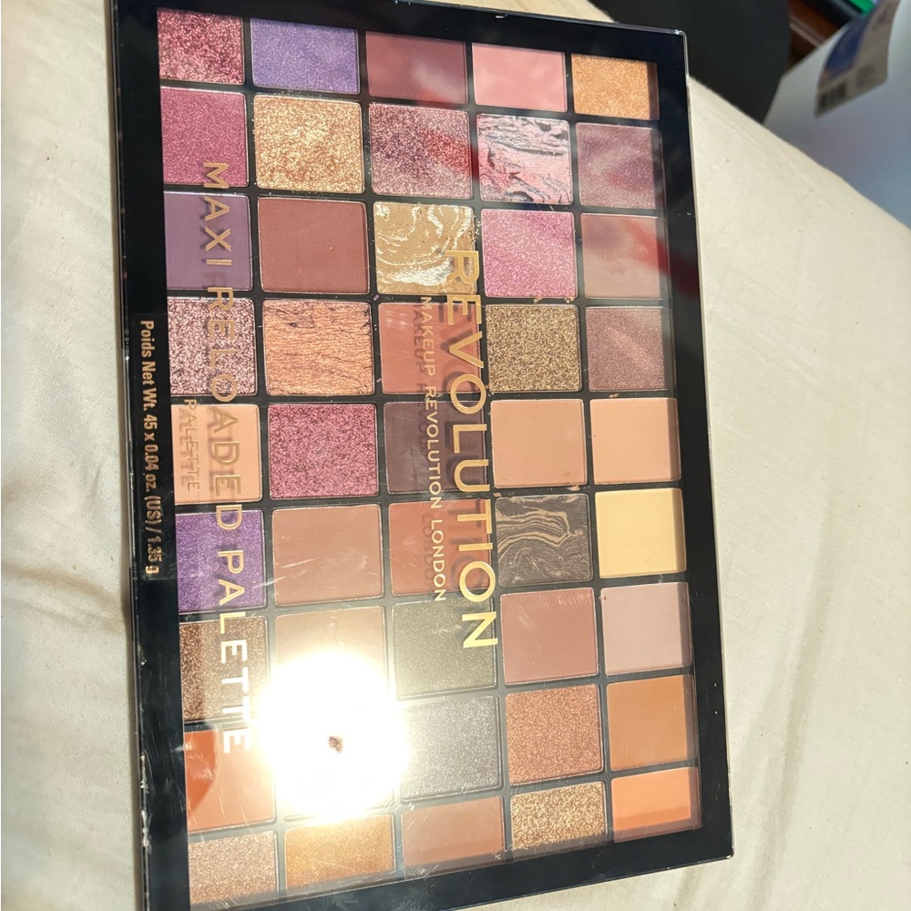 Revolution Eyeshadow Palette with Vibrant Colors and Various Finishes